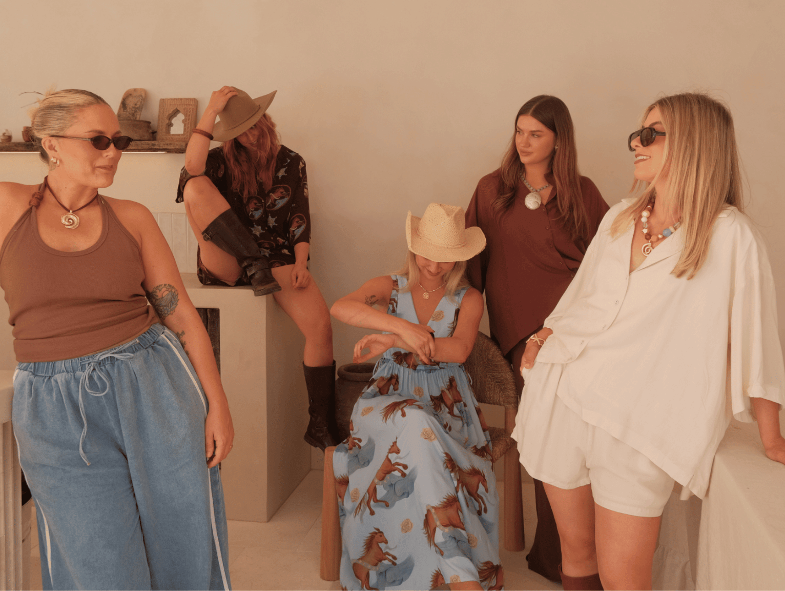 Women in blue and brown printed outfits