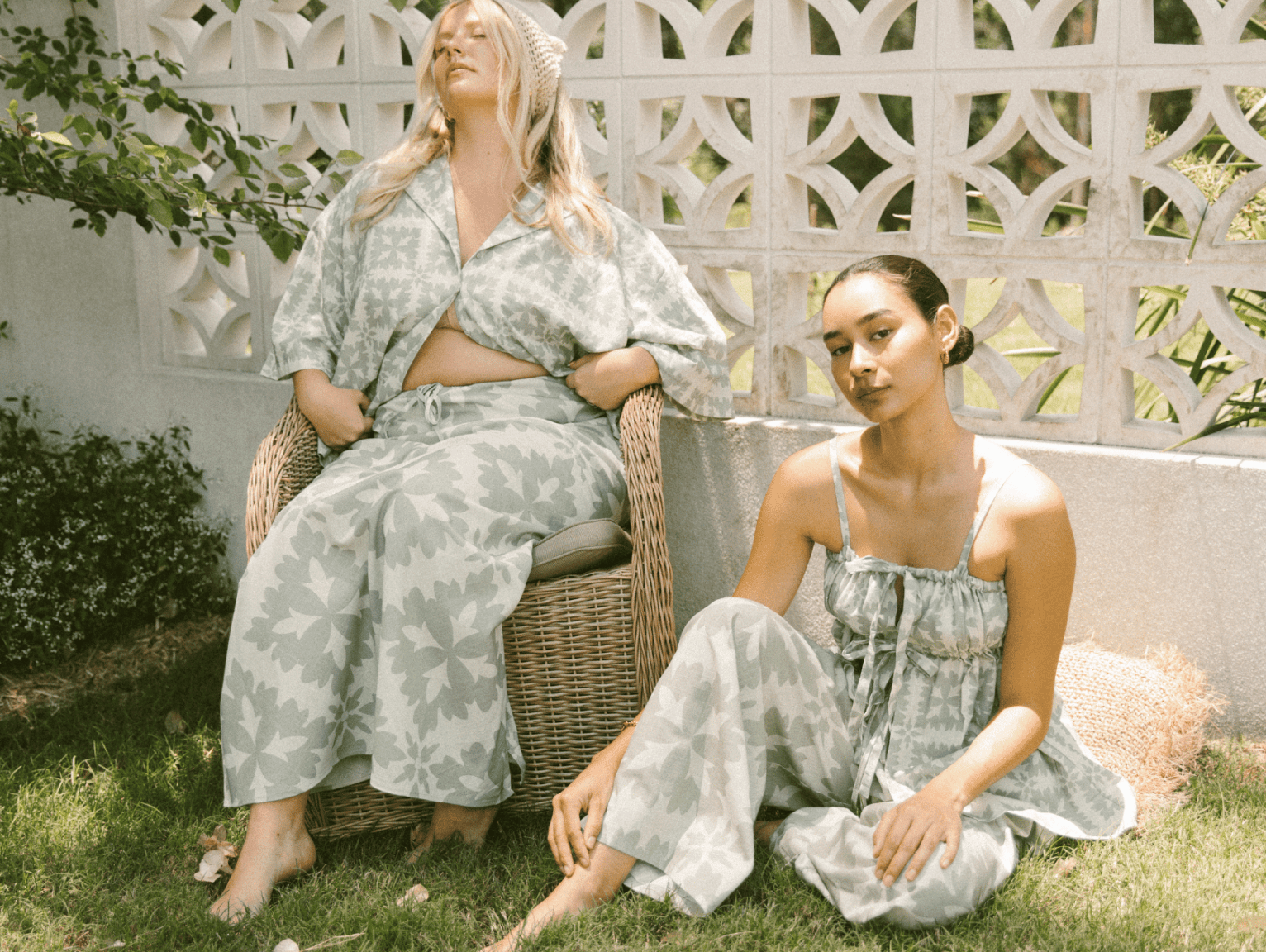 Three women wearing pink and red outfits
