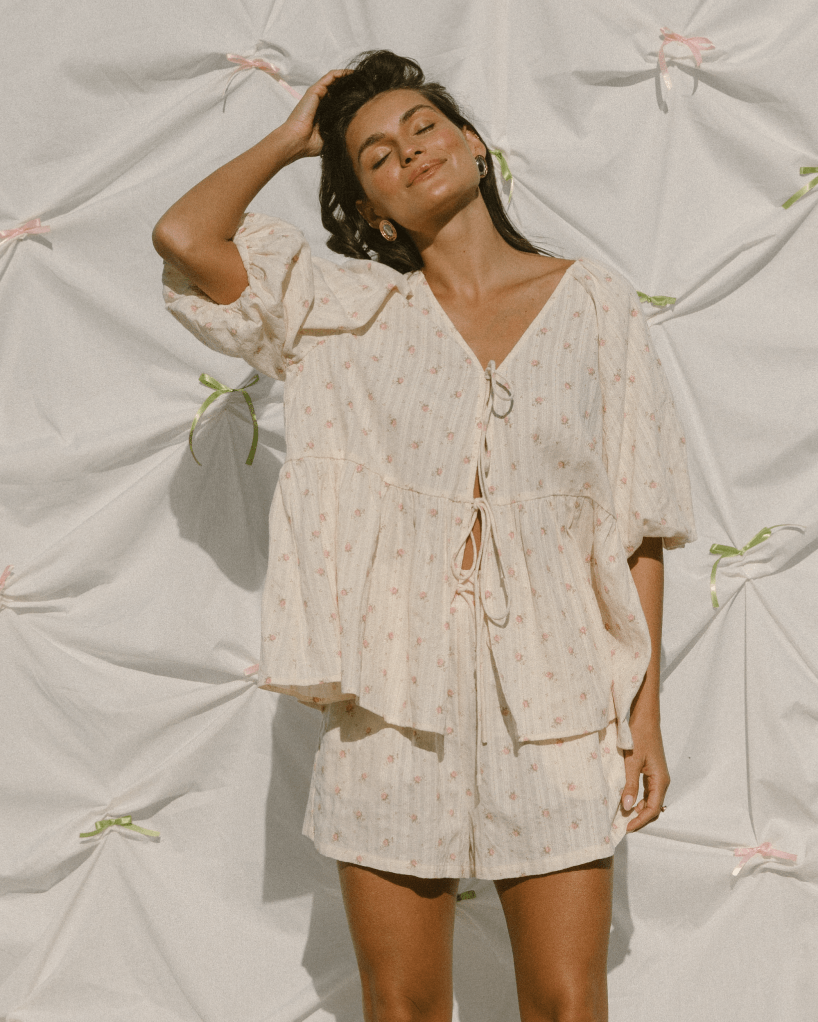 Woman wearing cottage-core inspired outfit with matching shirt & shorts.