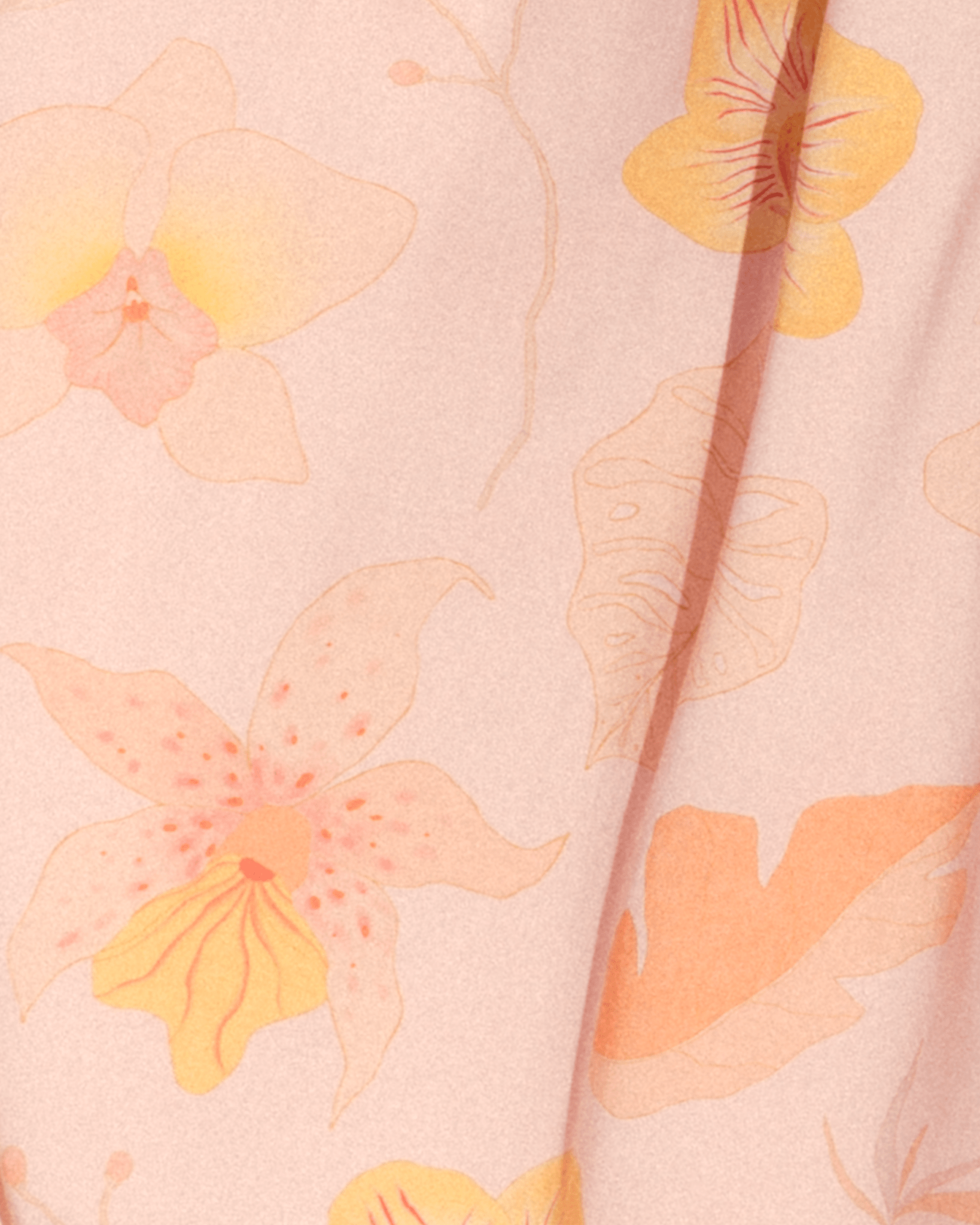 Up-close detail of light pink floral print.
