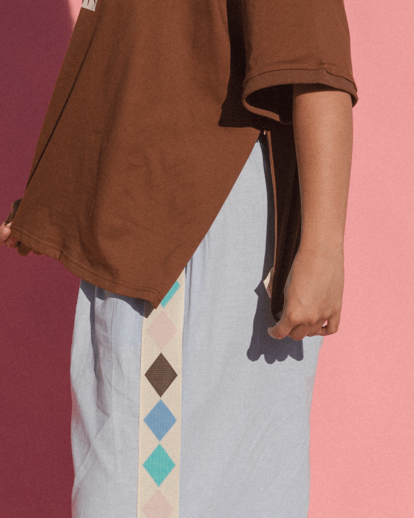 Details of oversizeds tshirt with side-seam breastfeeding zippers.