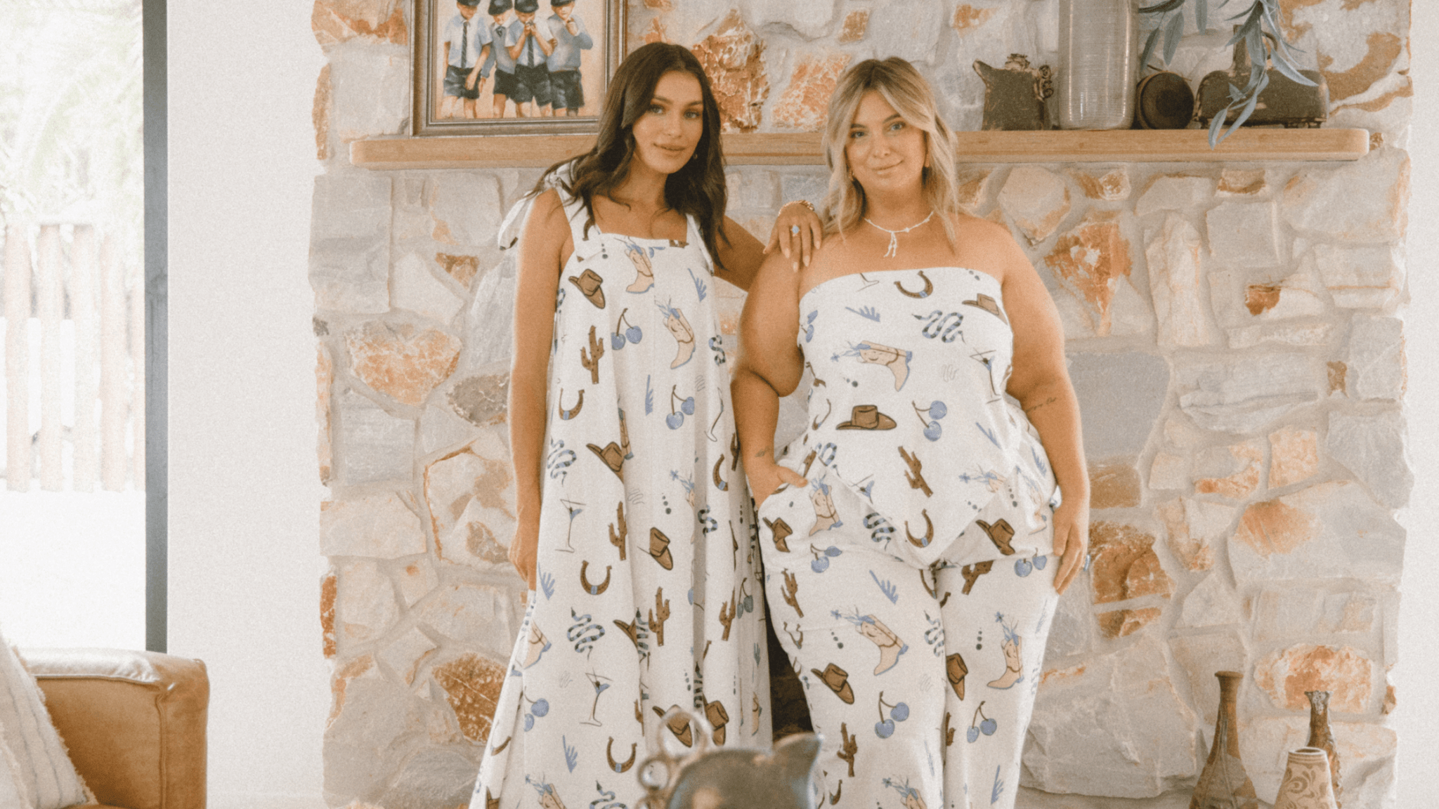 model and curve model posing in loungewear scarf top maxi dress in western print 