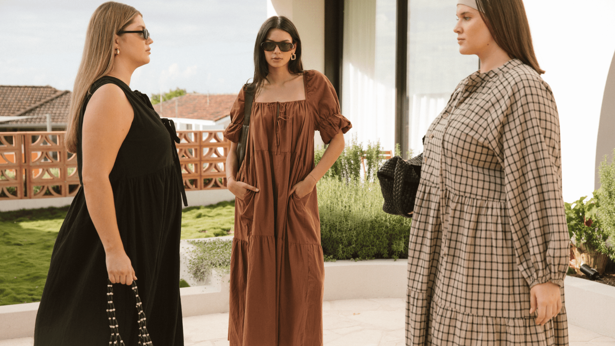 Models wearing The Lullaby Club Essentials Sets and Slouchy Jumpers in cream and cobalt blue. Featuring cozy winter loungewear with breastfeeding-friendly zips and relaxed fits. Designed for modern mums and everyday ease.