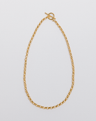 A chunky gold toggle necklace with a classic chain design, displayed against a white background.