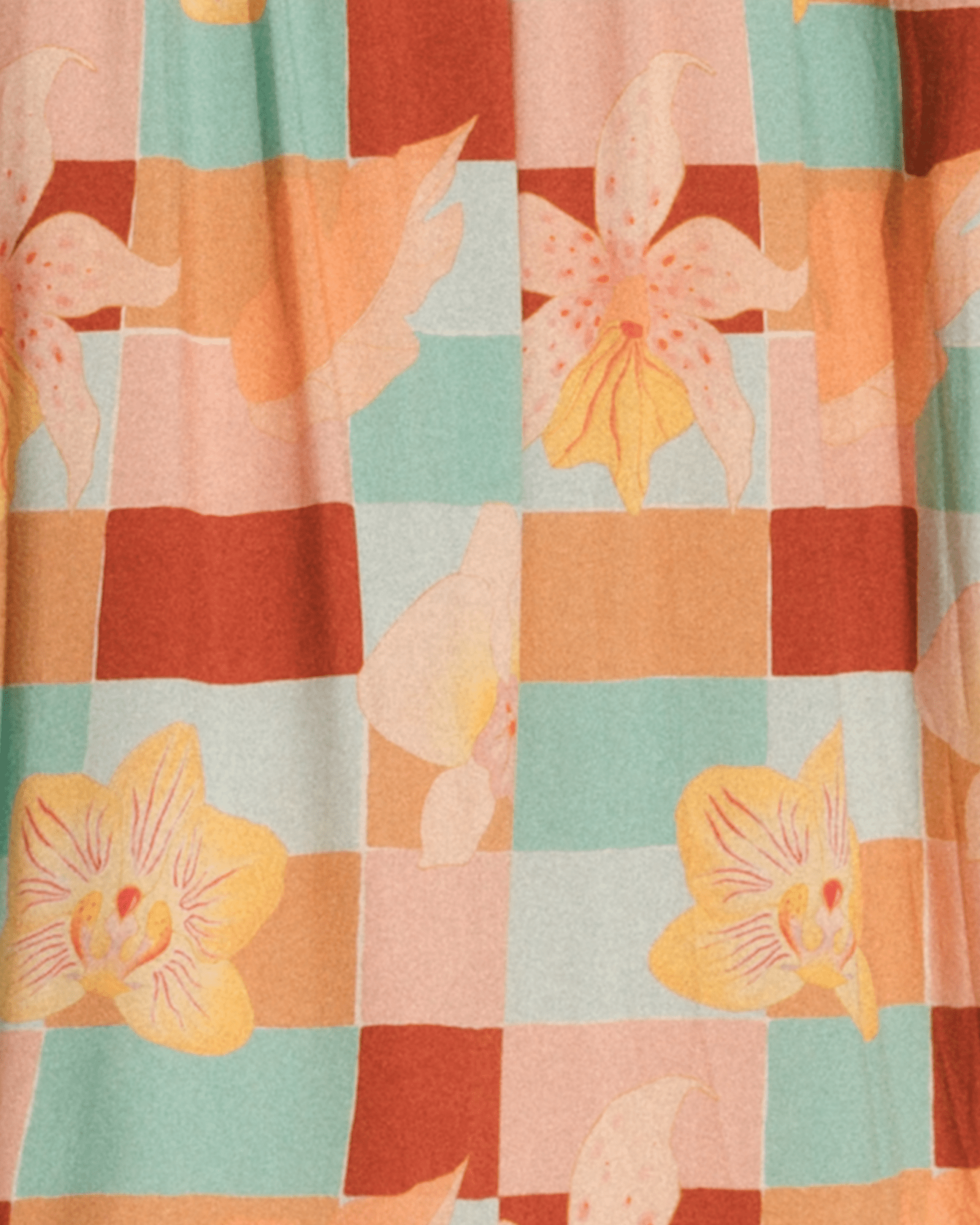 Fabric with a checkered pattern and floral designs in orange, pink, and green.