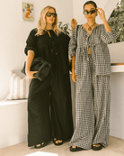 Pregnant woman wearing black maternity lounge pants - Posey Pants by The Lullaby Club